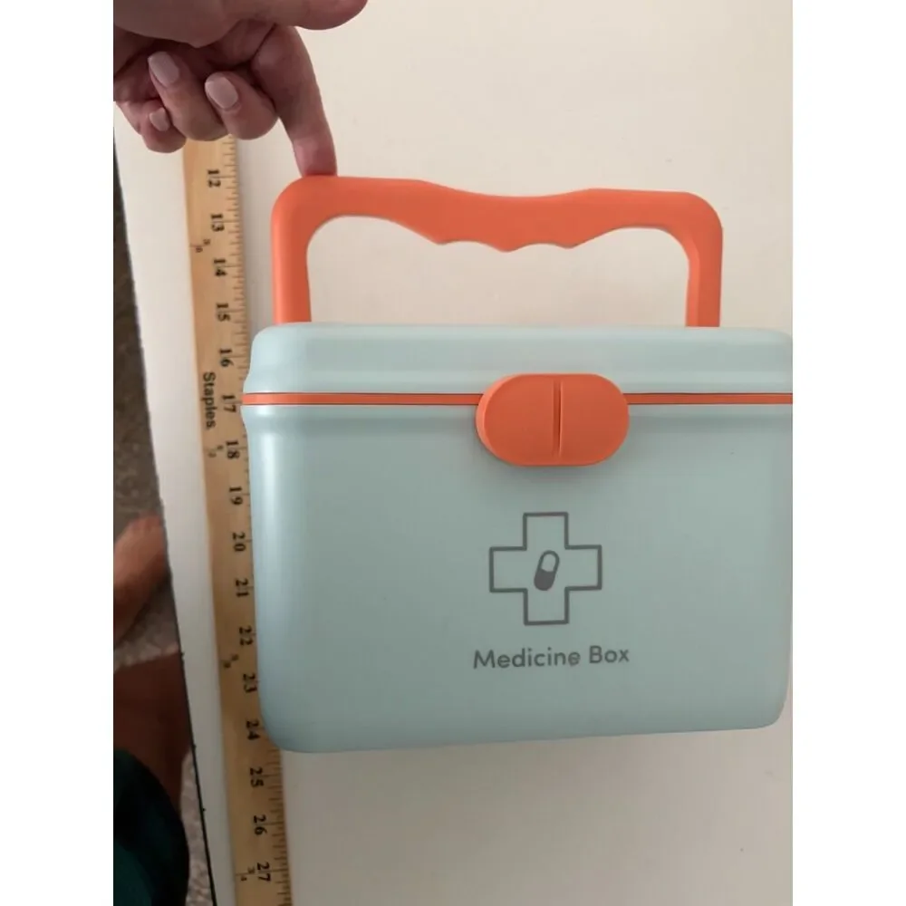 Modern portable plastic medicine box with orange handle and latch